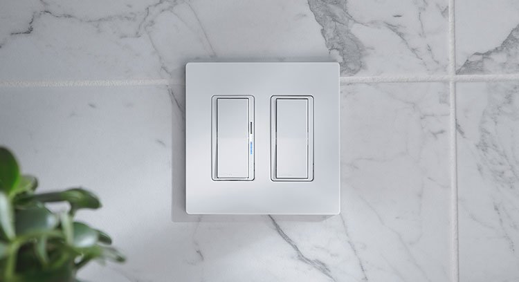Close-up view of stylish Decora dimmer switches installed on a wall, allowing for customizable lighting control in a modern home.