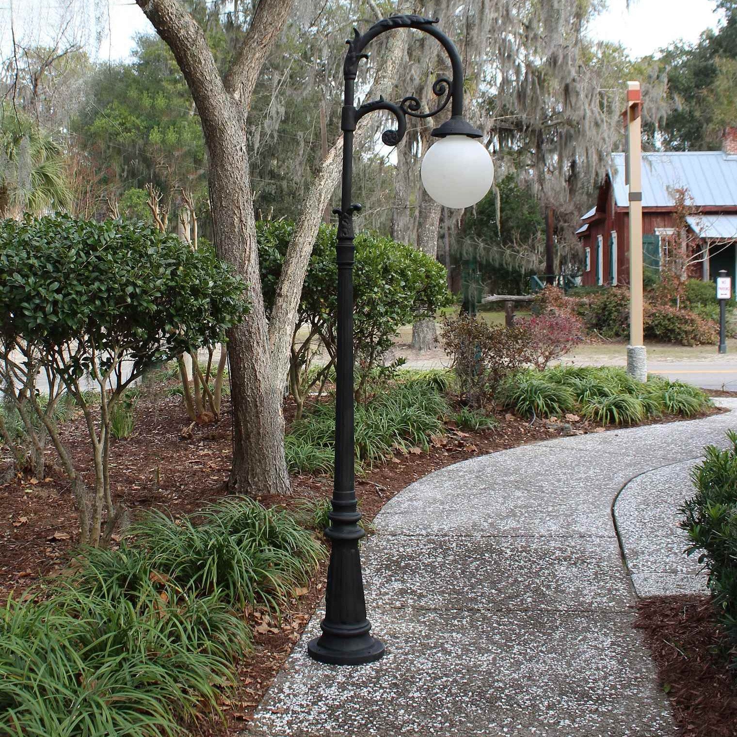 Damaged light pole in Garden District awaiting professional repair services.