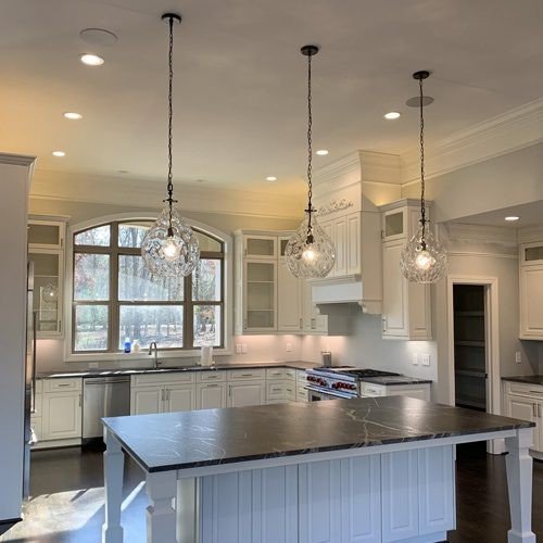 Kitchen remodel lighting installation in Metairie home with modern fixtures and professional wiring.