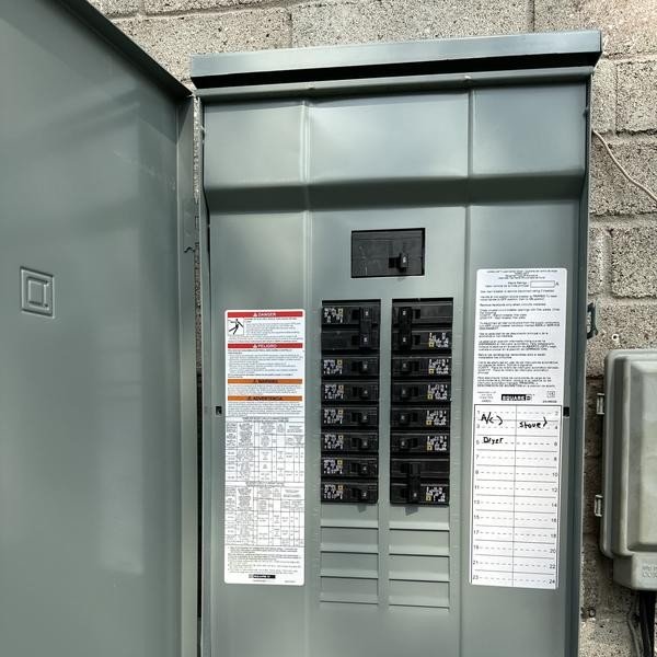 Licensed electrician from Sheep Electrical Service & Solutions performing a 200-amp electrical panel upgrade in a Metairie, LA home, replacing outdated breaker box with code-compliant, safe installation for improved capacity and reliability