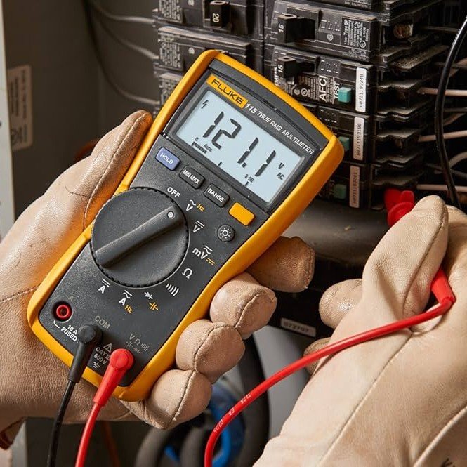 Homeowner using a digital multimeter to test wall outlet voltage in a Metairie home