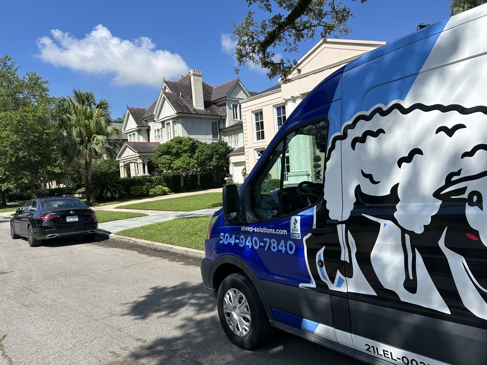 Sheep Electrical Service & Solutions van on a New Orleans residential street, serving Metairie and New Orleans with electrical repairs and installations.