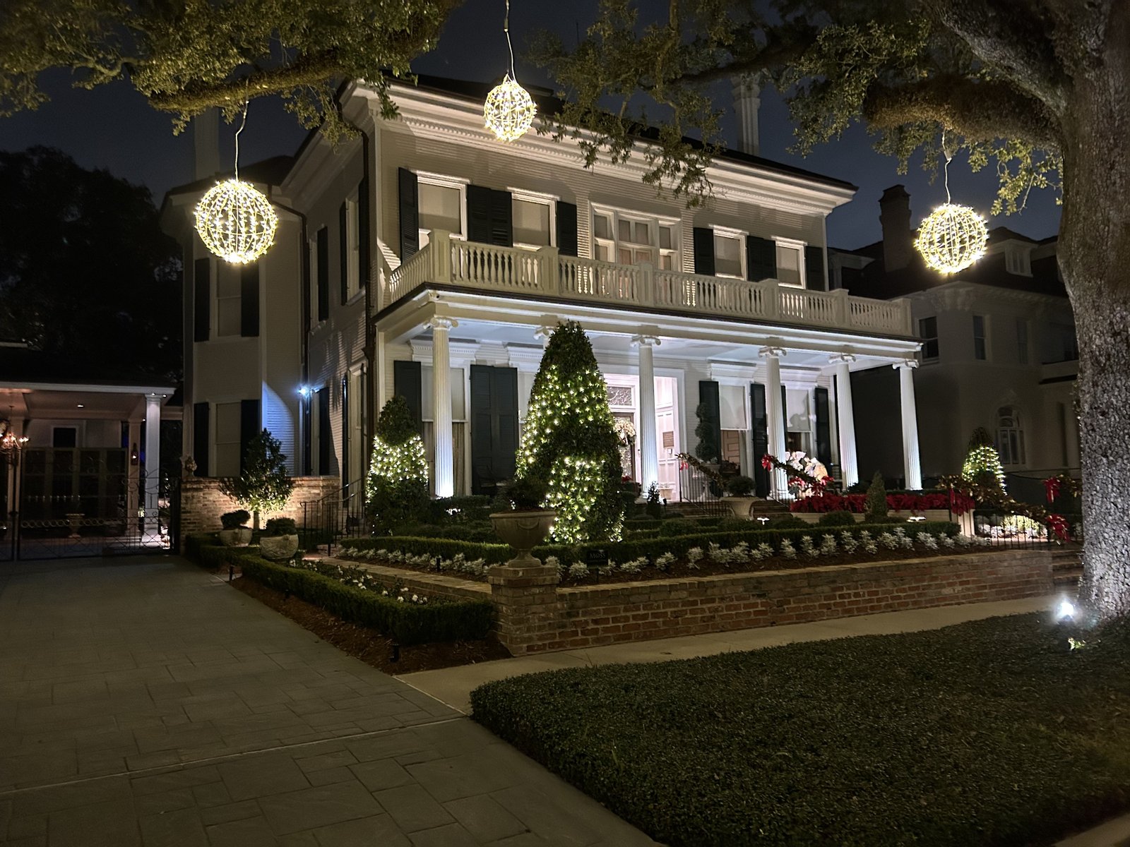 Outdoor lighting and holiday lights illuminating a New Orleans home, representing Sheep Electrical Service & Solutions electrical services in Metairie and New Orleans.