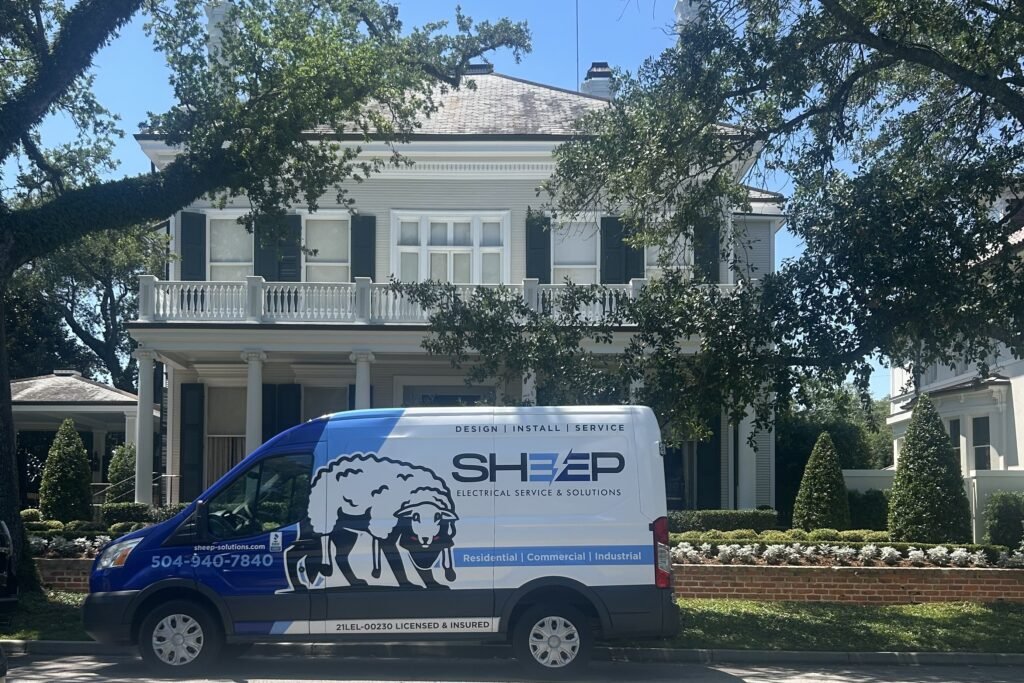 Sheep Electrical Service & Solutions service van parked outside a New Orleans home, providing residential and commercial electrical services in Metairie and New Orleans.
